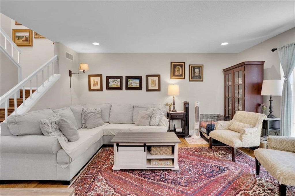 12 Sparrow Hill Lane Laguna Hills, CA 92653 - Photo 1 of 45 a living room with furniture potted plant and a rug