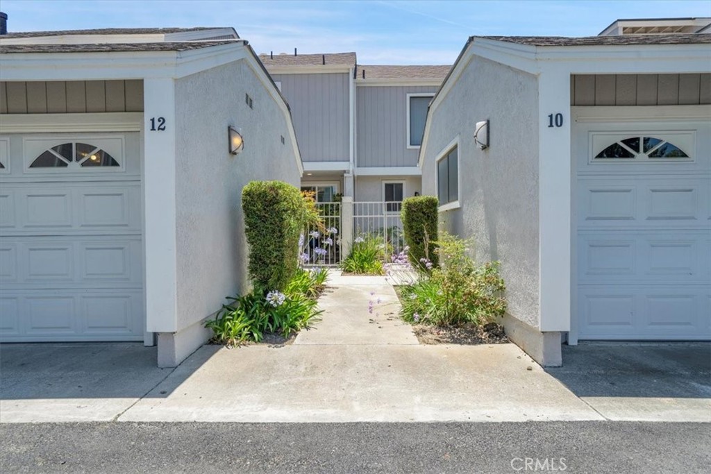 12 Sparrow Hill Lane Laguna Hills, CA 92653 - Photo 15 of 45 a front view of a house with garden
