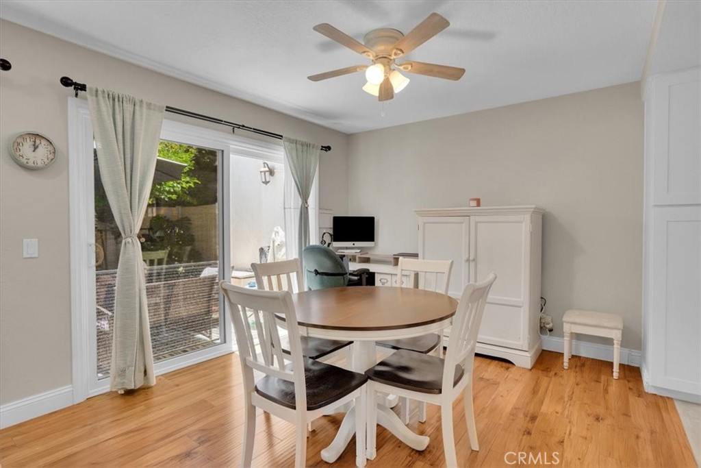 12 Sparrow Hill Lane Laguna Hills, CA 92653 - Photo 22 of 45 a dining room with furniture a window and wooden floor