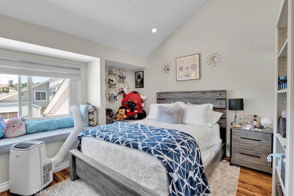 12 Sparrow Hill Lane Laguna Hills, CA 92653 - Photo 32 of 45 a bed room with a bed and furniture