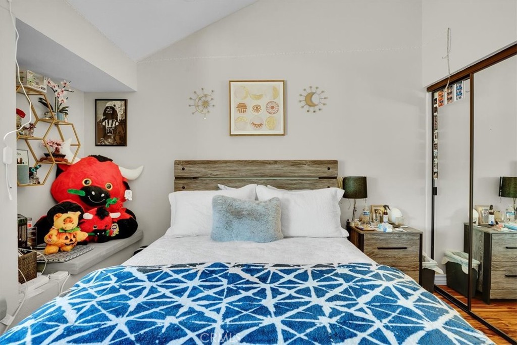 12 Sparrow Hill Lane Laguna Hills, CA 92653 - Photo 33 of 45 a bedroom with a bed and wooden floor