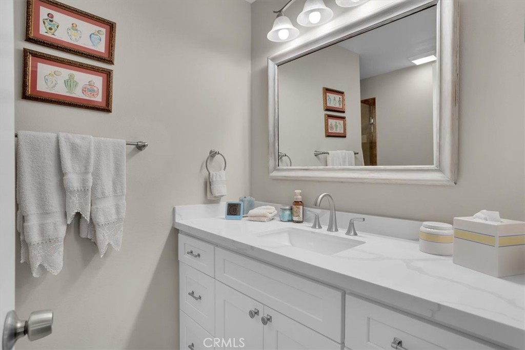 12 Sparrow Hill Lane Laguna Hills, CA 92653 - Photo 42 of 45 a bathroom with a sink and a mirror