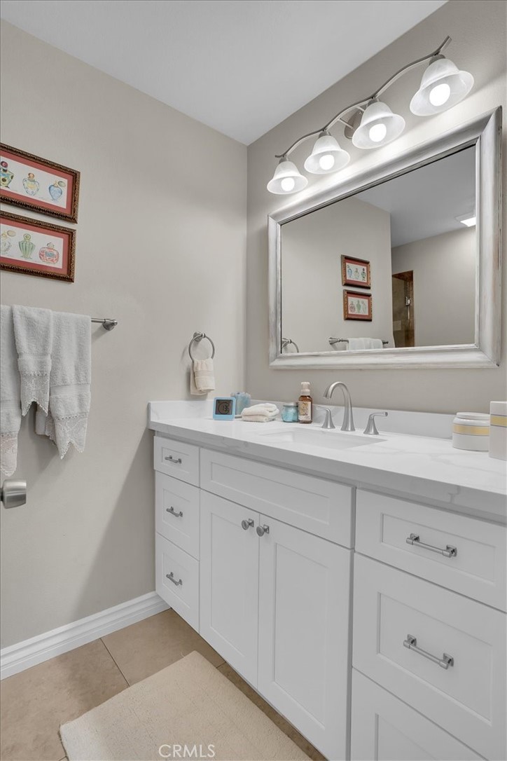 12 Sparrow Hill Lane Laguna Hills, CA 92653 - Photo 43 of 45 a bathroom with double vanity sink and a mirror