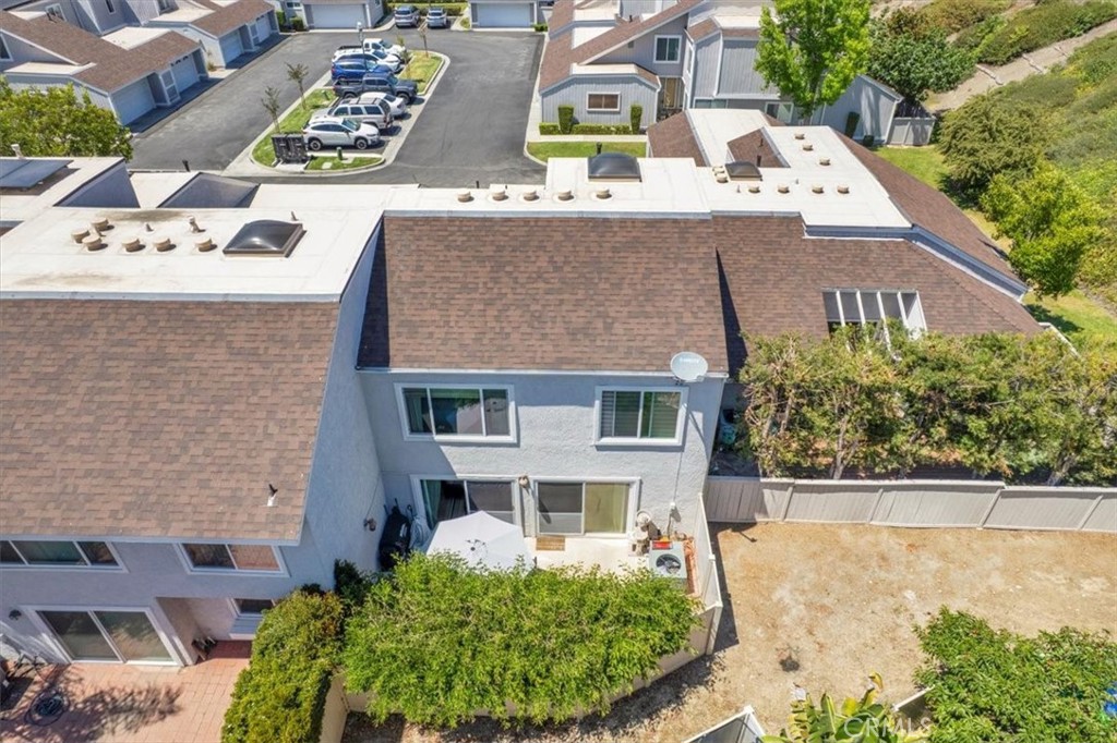 12 Sparrow Hill Lane Laguna Hills, CA 92653 - Photo 9 of 45 a aerial view of a house with a yard and potted plants