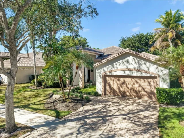 a view of a wooden door and a yard