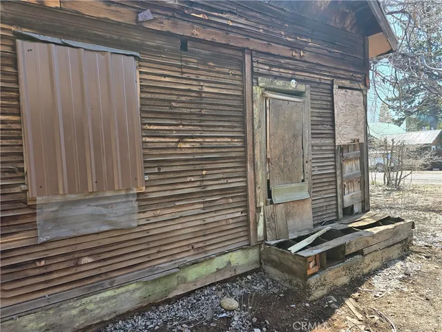 a bench sitting in front of a door