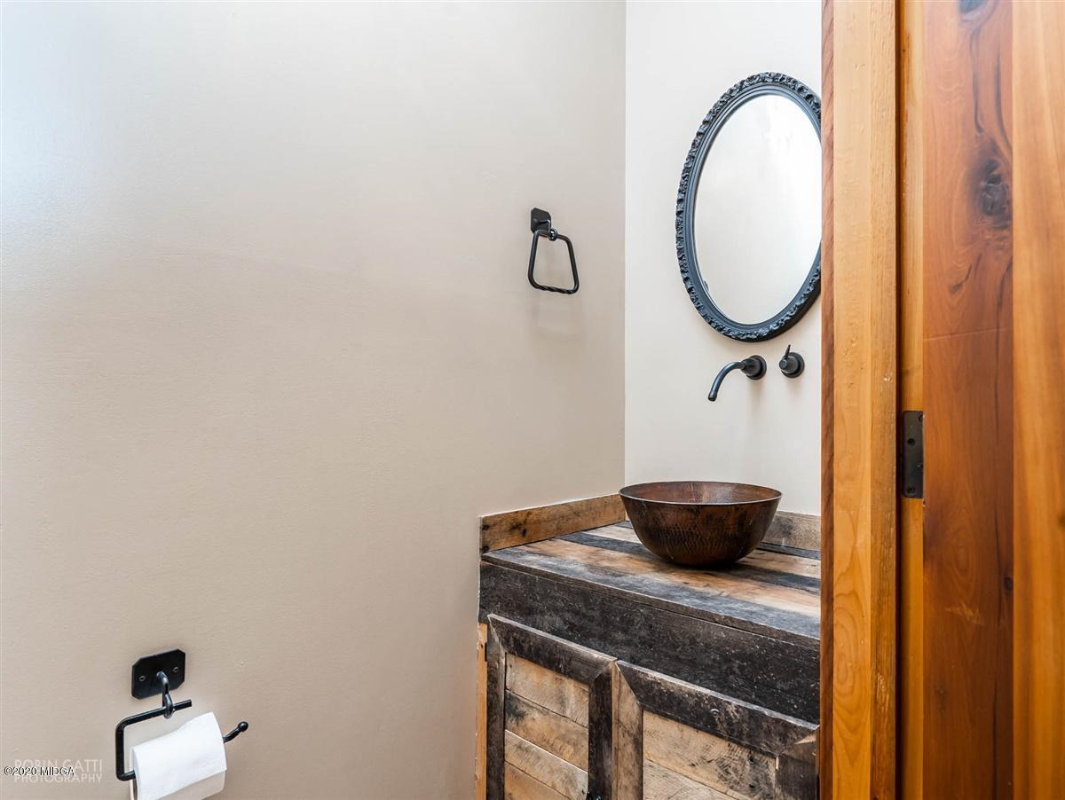 545 Gose Road Forsyth, GA 31029 - Photo 15 of 36 a bathroom with a granite countertop sink and a mirror