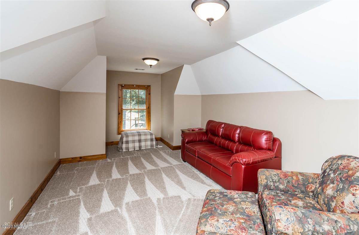 545 Gose Road Forsyth, GA 31029 - Photo 24 of 36 a living room with a couch and a window