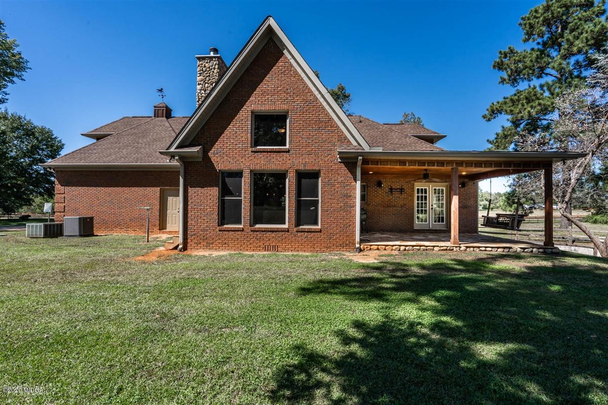545 Gose Road Forsyth, GA 31029 - Photo 27 of 36 a front view of a house with a garden