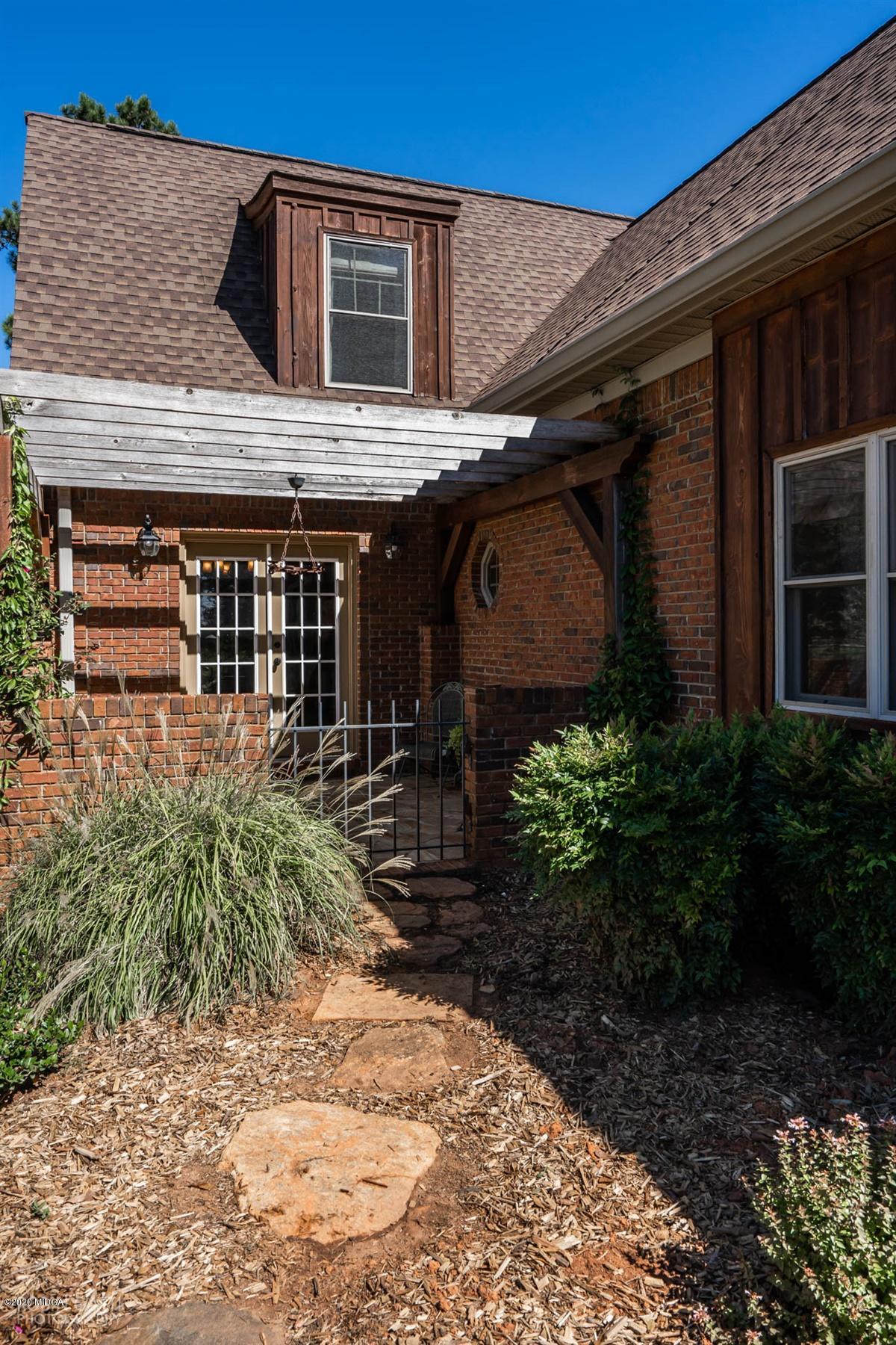 545 Gose Road Forsyth, GA 31029 - Photo 33 of 36 a front view of a house with garden