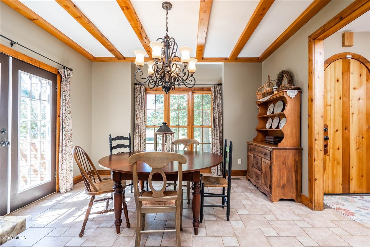 545 Gose Road Forsyth, GA 31029 - Photo 6 of 36 a view of a dining room with furniture window and outside view