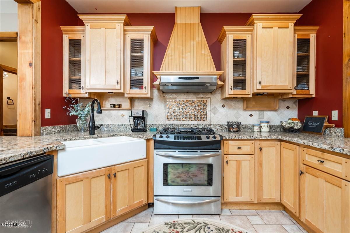 545 Gose Road Forsyth, GA 31029 - Photo 7 of 36 a kitchen with stainless steel appliances granite countertop a stove and a sink