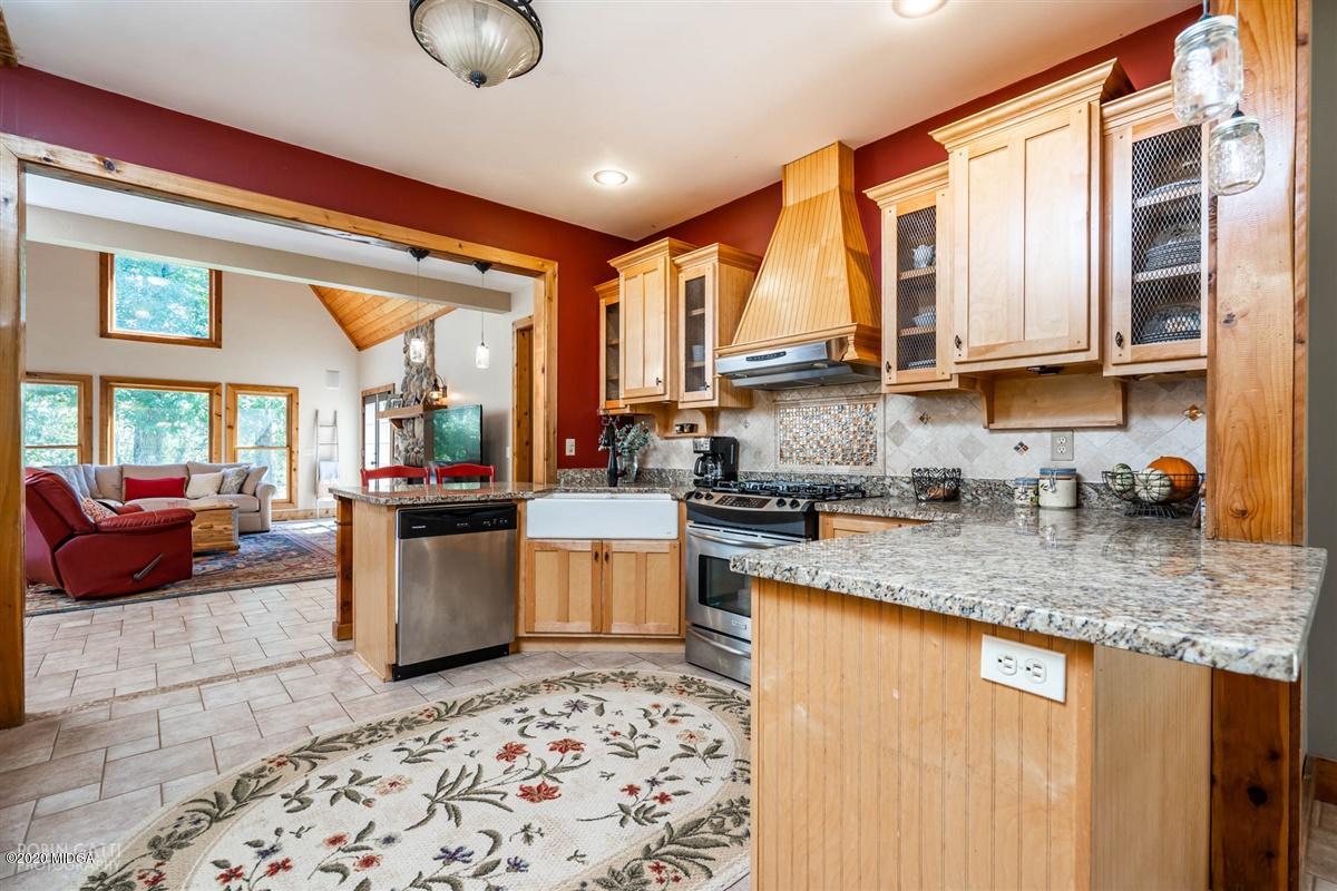 545 Gose Road Forsyth, GA 31029 - Photo 8 of 36 a kitchen with stainless steel appliances granite countertop a sink stove and cabinets