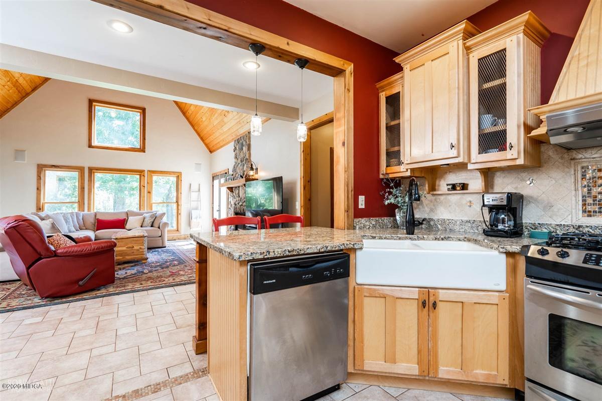 545 Gose Road Forsyth, GA 31029 - Photo 10 of 36 a kitchen with stainless steel appliances granite countertop a stove and a refrigerator