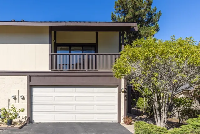 a front view of a house with a garage