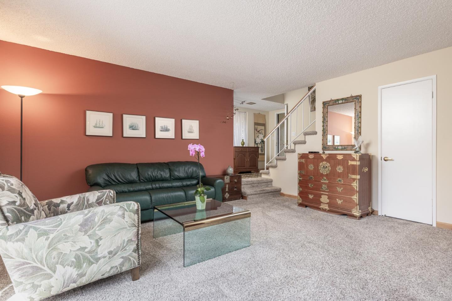 1360 Josselyn Canyon Road, Unit 40 Monterey, CA 93940 - Photo 5 of 18 a living room with furniture and a fireplace