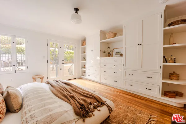 a bedroom with a bed and a view of bedroom