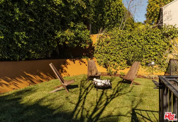 view of swimming pool with a garden
