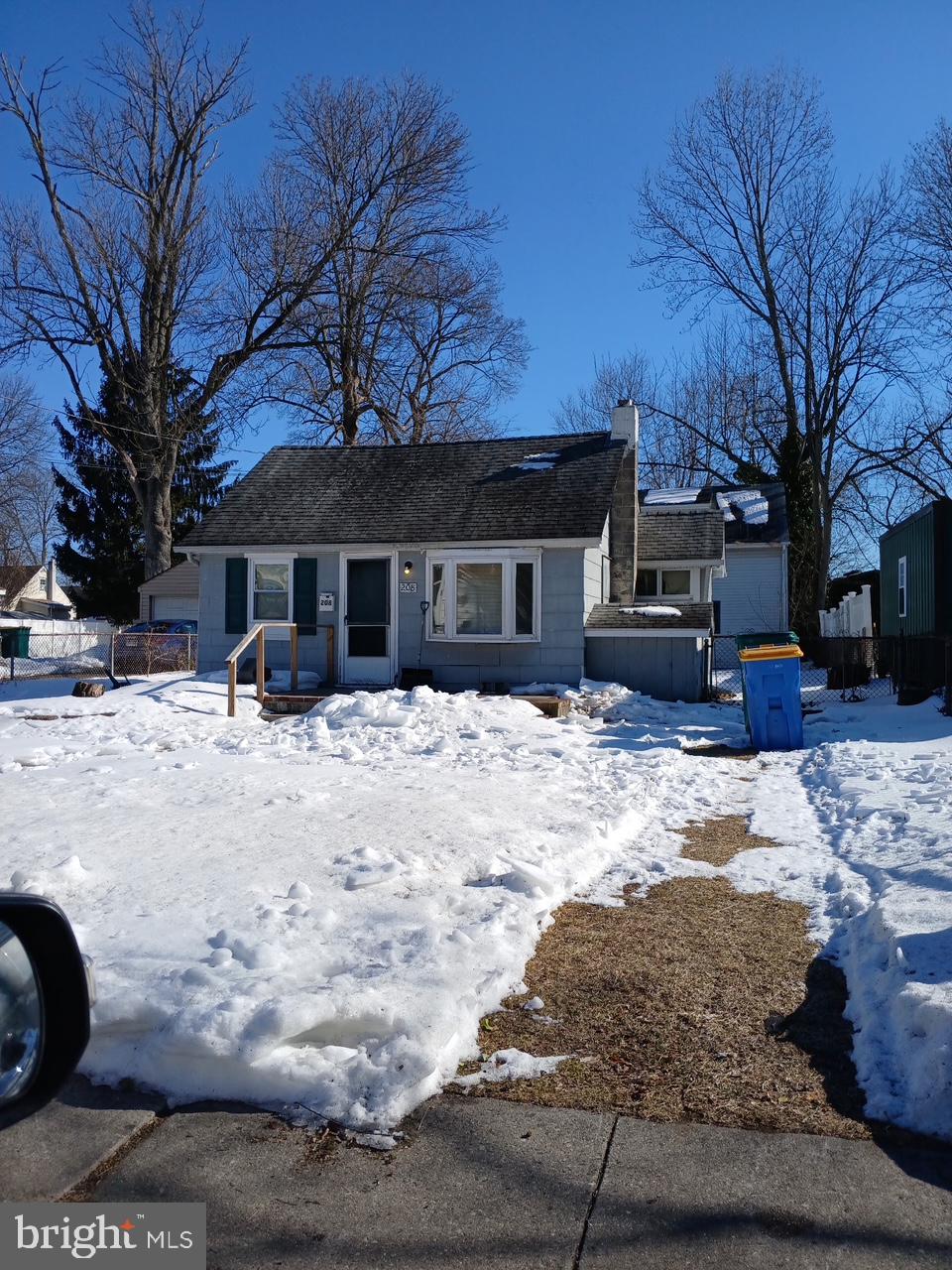 208 Neshaminy Road Croydon, PA 19021 - Photo 1 of 6 a view of a house with a yard covered in snow