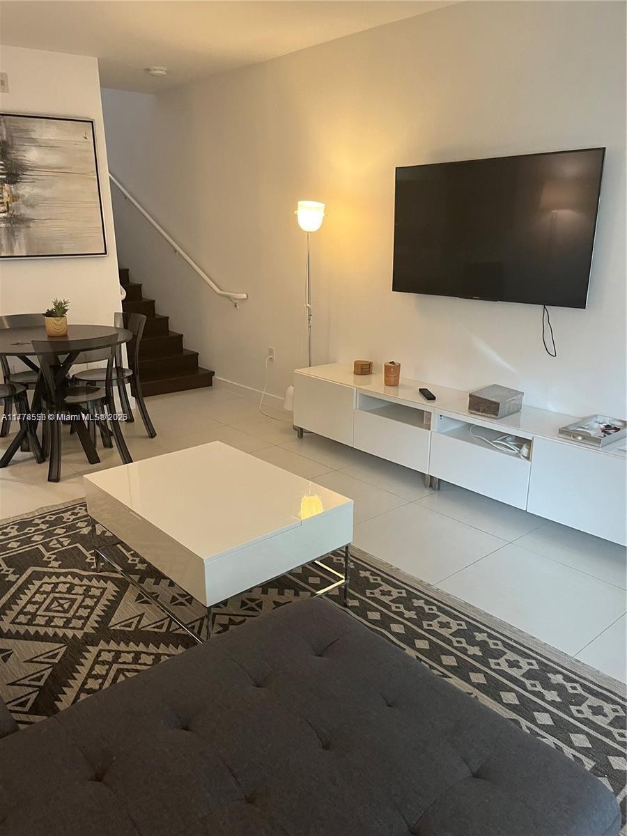 2130 Park Avenue, Unit 4 Miami Beach, FL 33139 - Photo 5 of 12 a living room with furniture and a flat screen tv