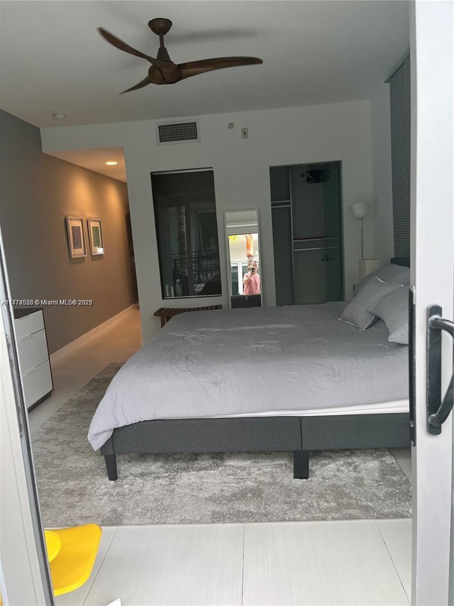 2130 Park Avenue, Unit 4 Miami Beach, FL 33139 - Photo 9 of 12 a bedroom with a bed and a fireplace