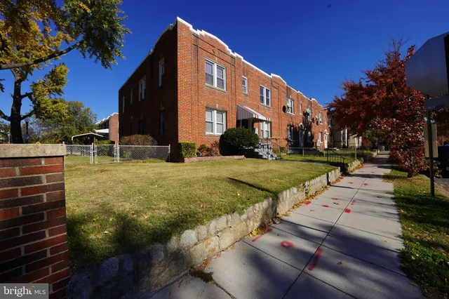 a view of a building with a yard