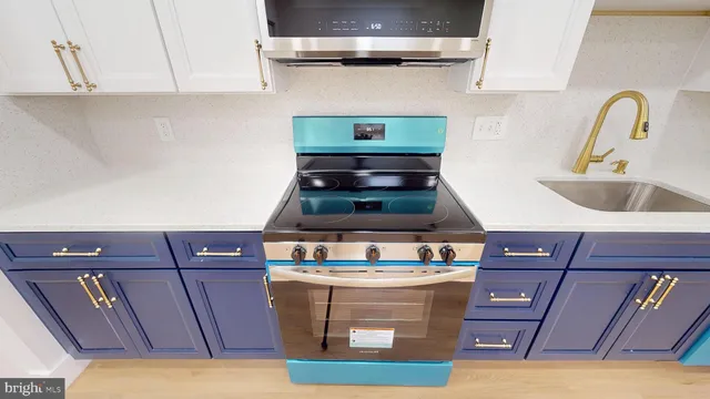a kitchen with a cabinets and wooden floor