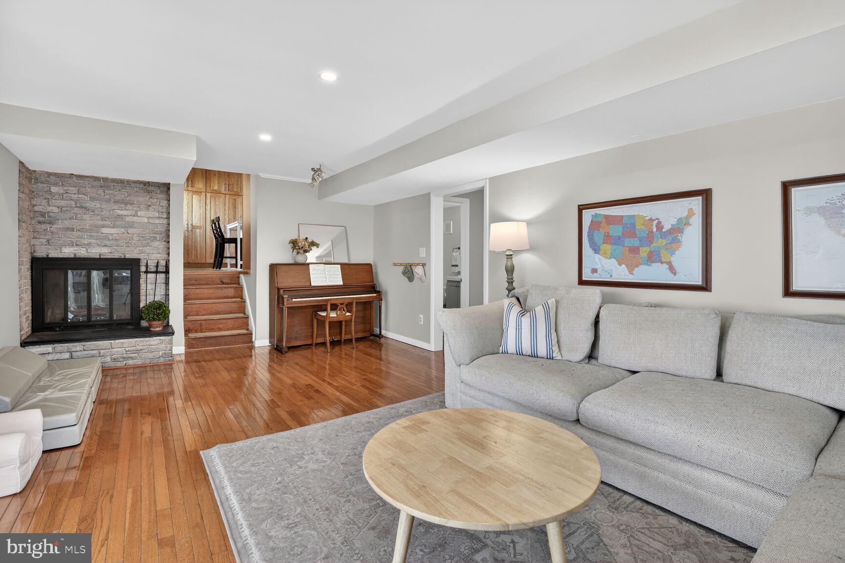 9900 Fernwood Road Bethesda, MD 20817 - Photo 15 of 39 a living room with furniture and a wooden floor