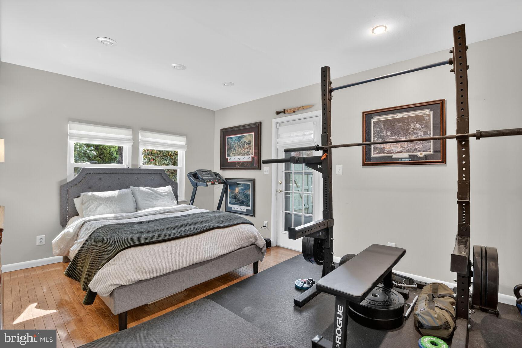 9900 Fernwood Road Bethesda, MD 20817 - Photo 18 of 39 a bedroom with a bed window and chair