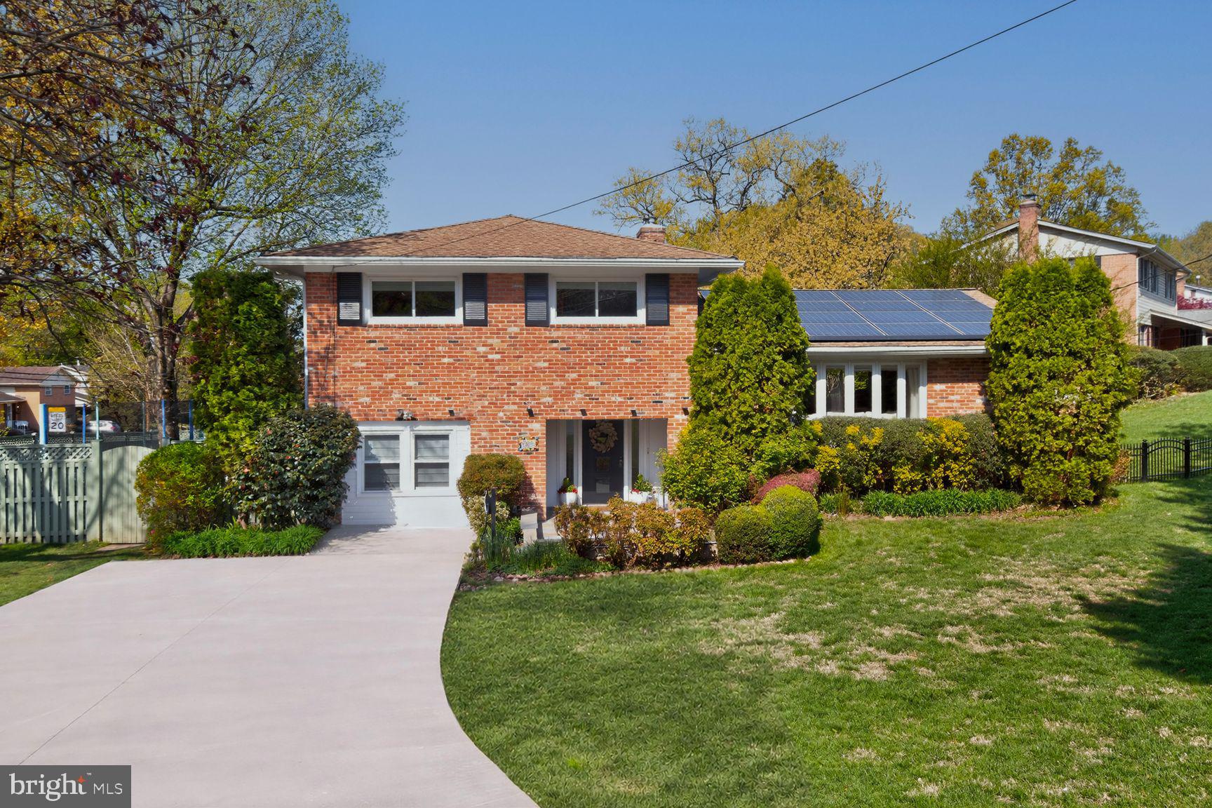 9900 Fernwood Road Bethesda, MD 20817 - Photo 2 of 39 a front view of a house with garden