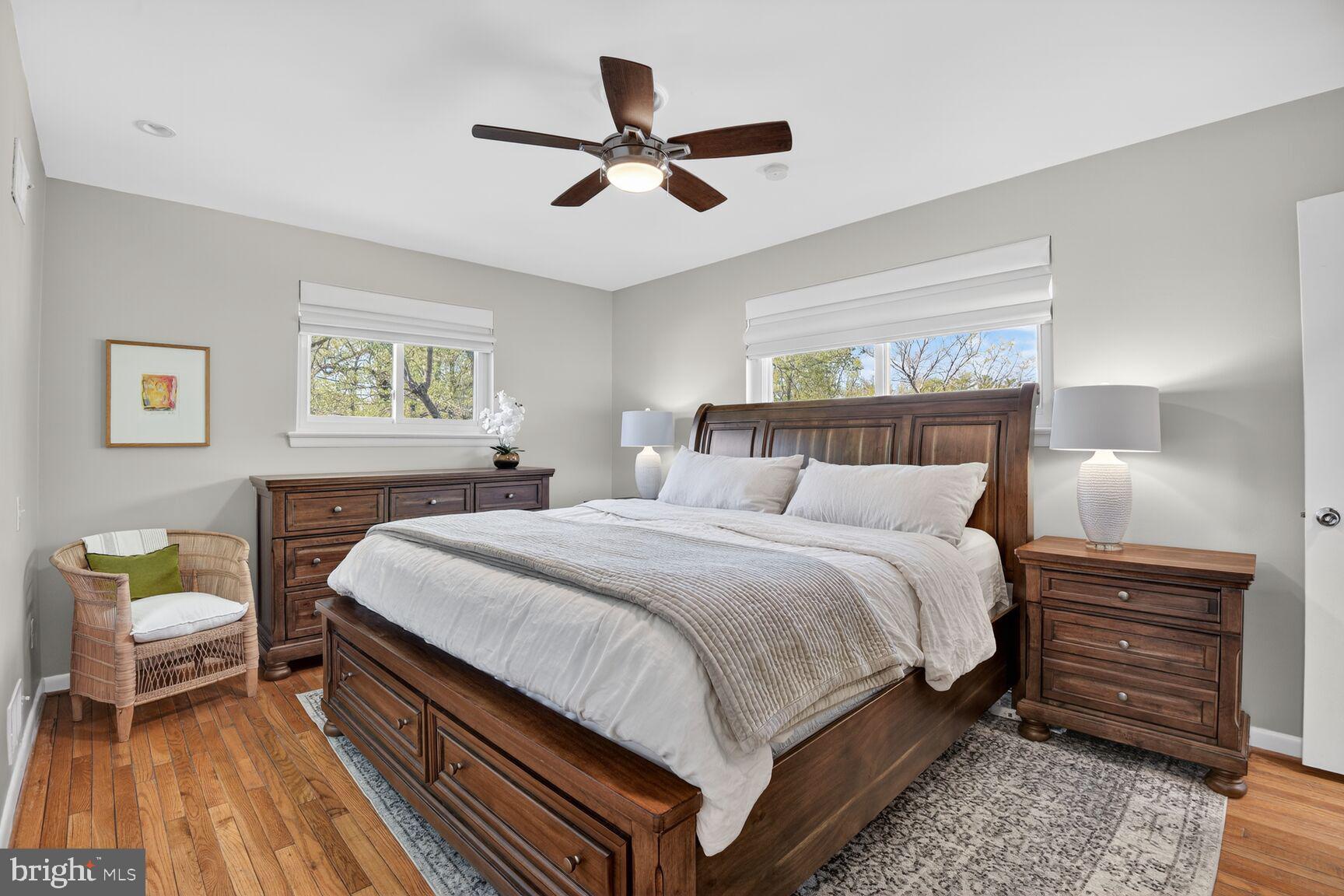9900 Fernwood Road Bethesda, MD 20817 - Photo 21 of 39 a bedroom with a bed and a chandelier