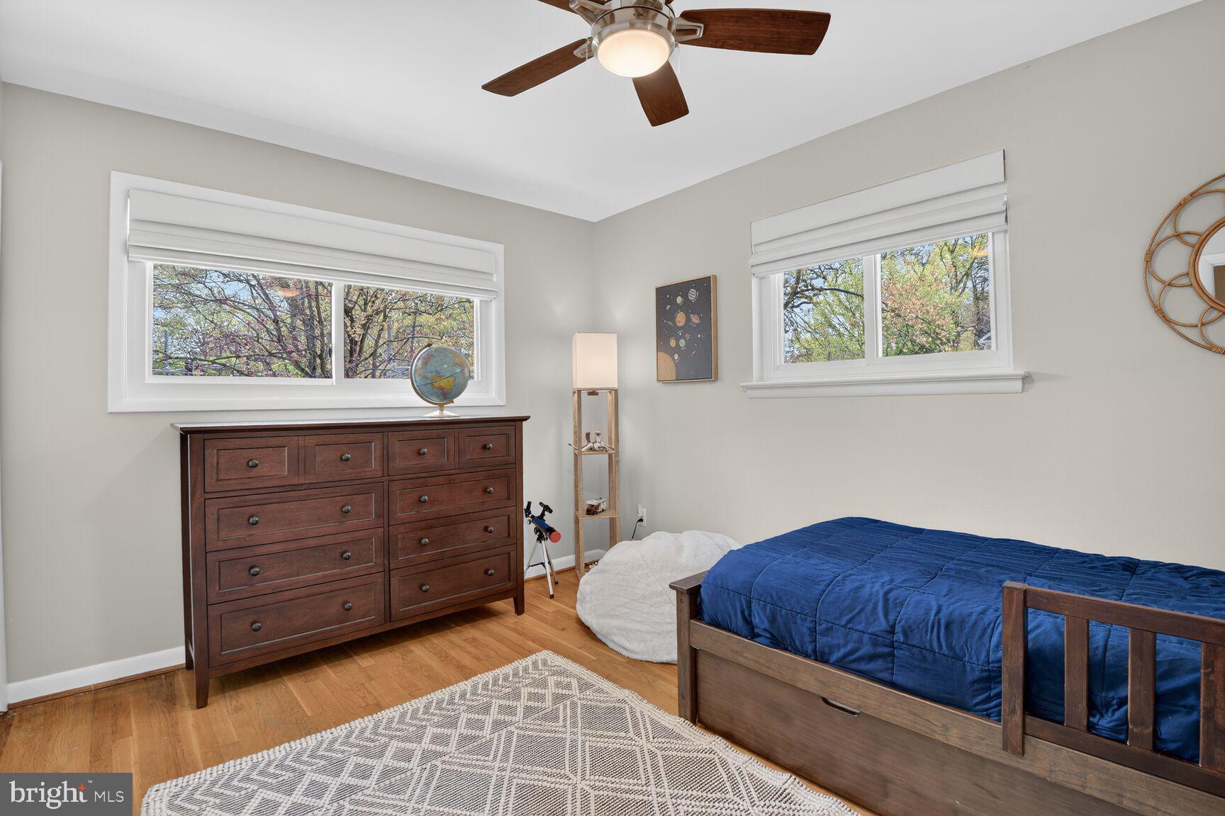 9900 Fernwood Road Bethesda, MD 20817 - Photo 23 of 39 a bedroom with a bed and a dresser