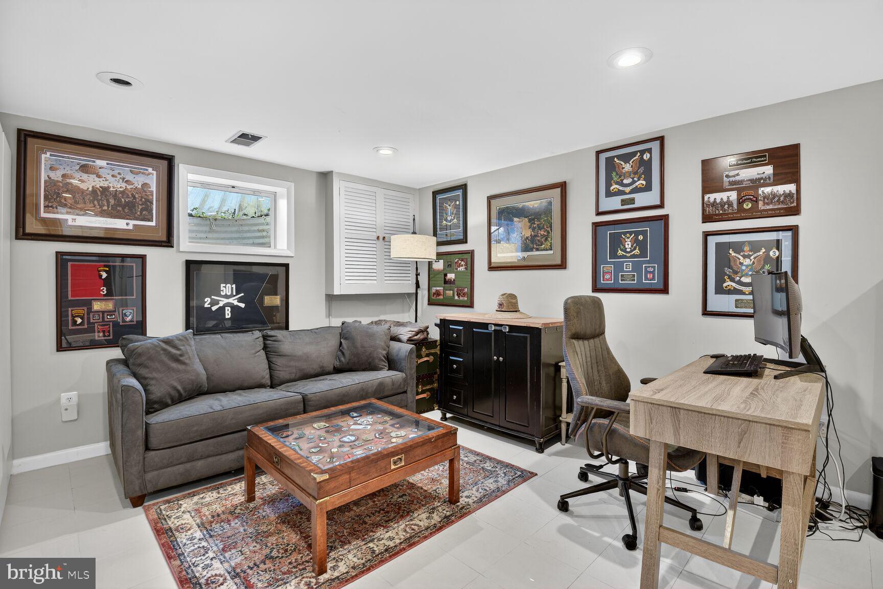 9900 Fernwood Road Bethesda, MD 20817 - Photo 28 of 39 a living room with furniture ceiling fan and a window