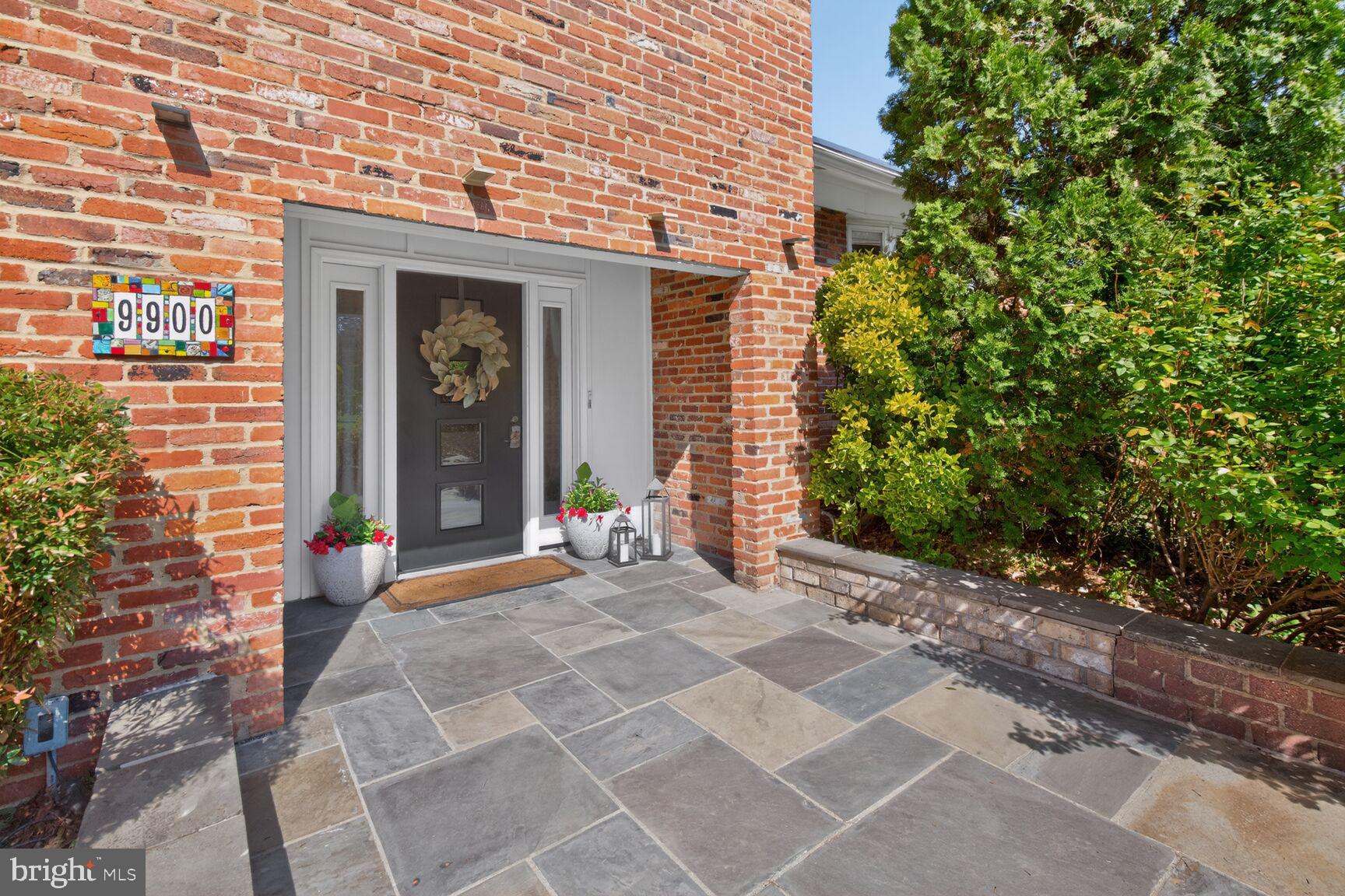 9900 Fernwood Road Bethesda, MD 20817 - Photo 3 of 39 a view of a brick house with outdoor space