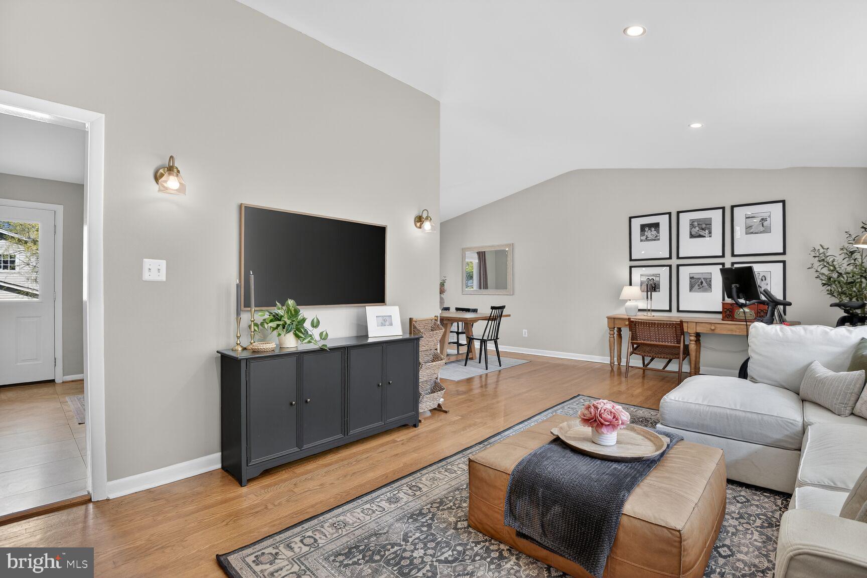 9900 Fernwood Road Bethesda, MD 20817 - Photo 7 of 39 a living room with furniture and a flat screen tv
