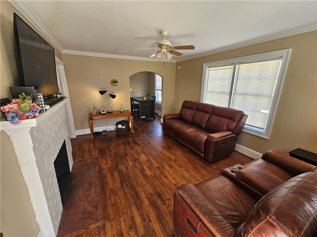 237 Pine Lane Anderson, SC 29621 - Photo 9 of 23 This inviting living area boasts hardwood flooring, a charming fireplace, and a seamless flow into the dining space.