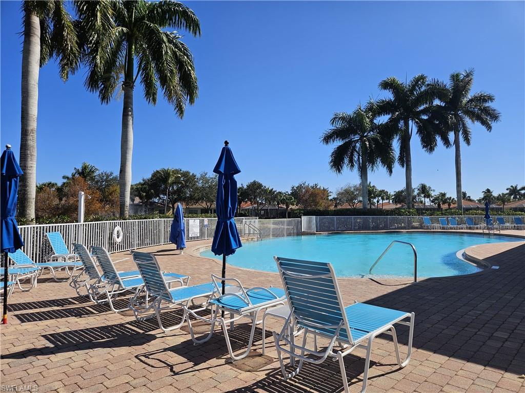 14536 Grapevine Drive Naples, FL 34114 - Photo 32 of 39 Community pool featuring a patio area