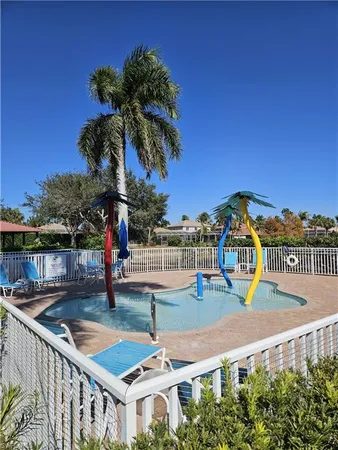 a view of a swimming pool with a lounge chairs
