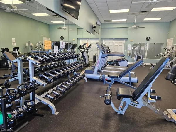 an empty room with gym equipment