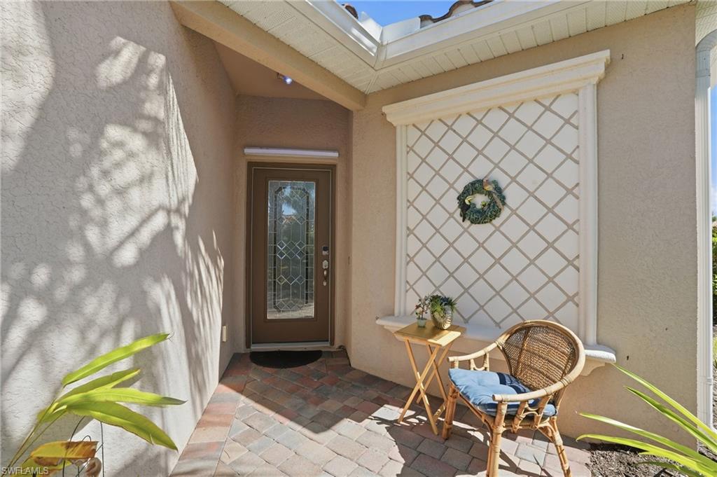 14536 Grapevine Drive Naples, FL 34114 - Photo 7 of 39 Entrance to property featuring stucco siding