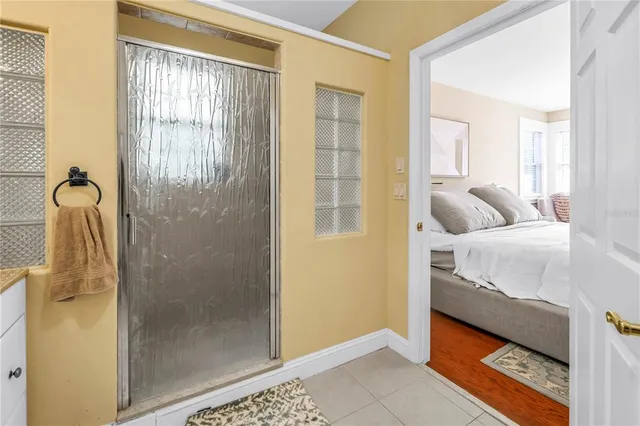 a room with furniture pool table and window