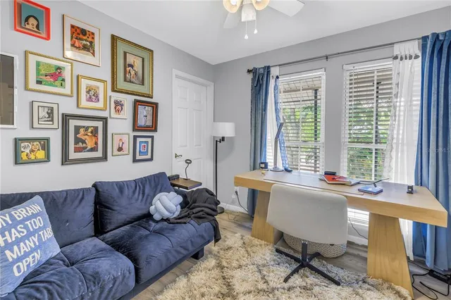 a view of a white house with a yard