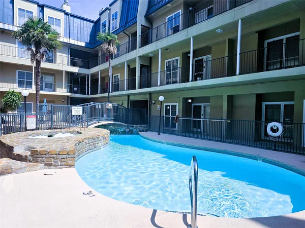 a view of a building with a swimming pool