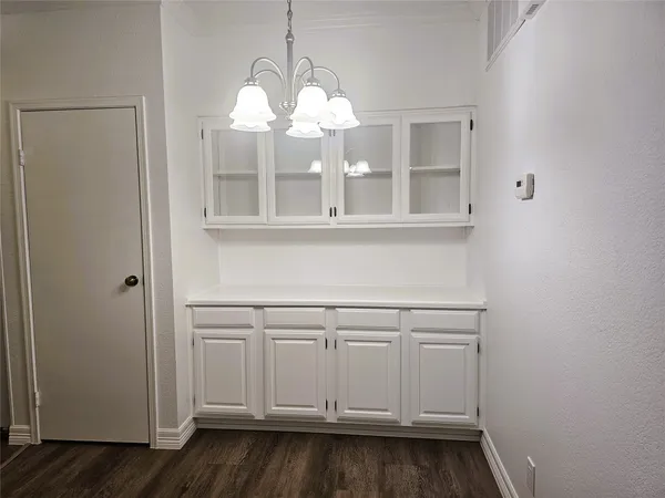 a view of a cabinets and wooden floor