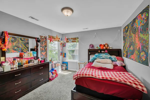 a bedroom with a bed and a closet