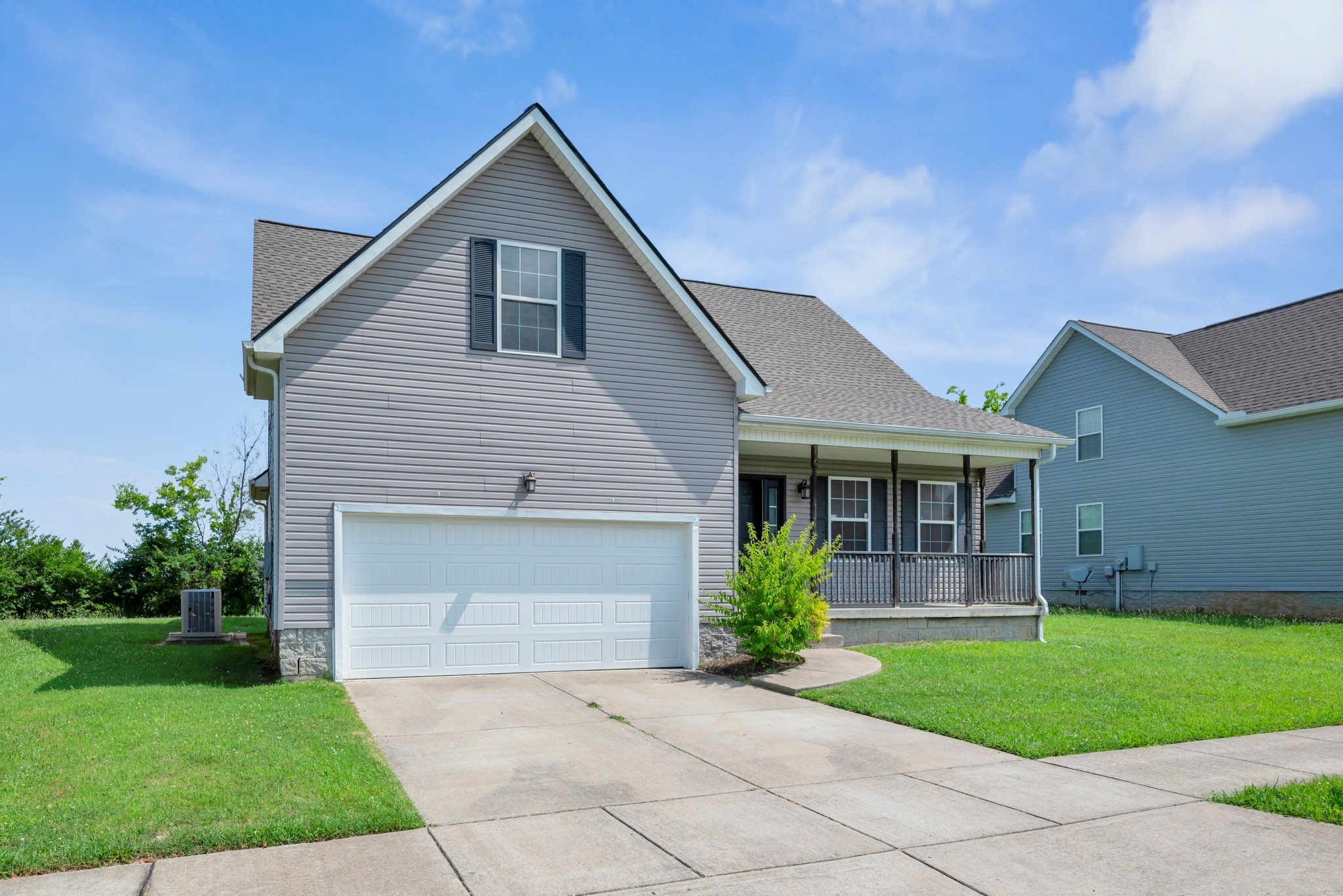 756 Maylene Drive Madison, TN 37115 - Photo 24 of 25 a front view of a house with a garden and plants