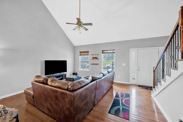 a living room with furniture and a flat screen tv