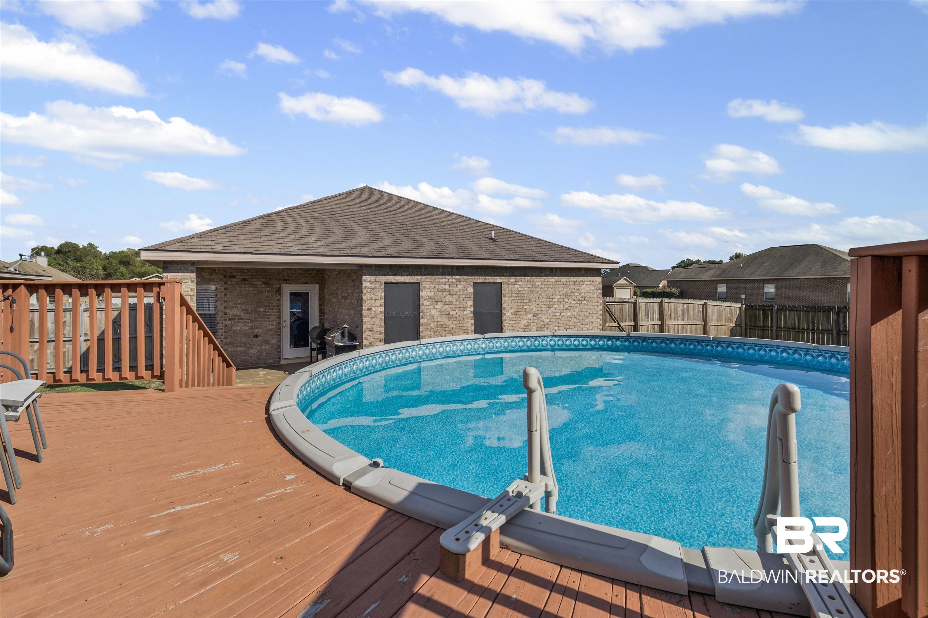4107 Nottingham Drive Semmes, AL 36575 - Photo 19 of 23 View of swimming pool with a deck, a fenced backyard, and a patio