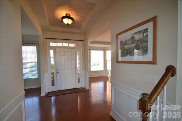 a view of an entryway with wooden floor