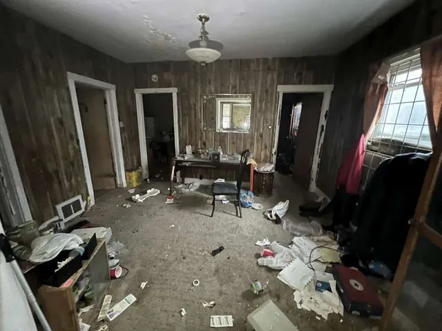 a room with gym equipment and windows